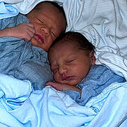 Masai Rhe Ra Iaomai joined the competition — help win amazing prizes! newborn, baby, sleeping, blanket, blue, cozy, infant, swaddled, cute, peaceful, child, soft, bed, portrait, two, bundle, face, resting, twin, warm