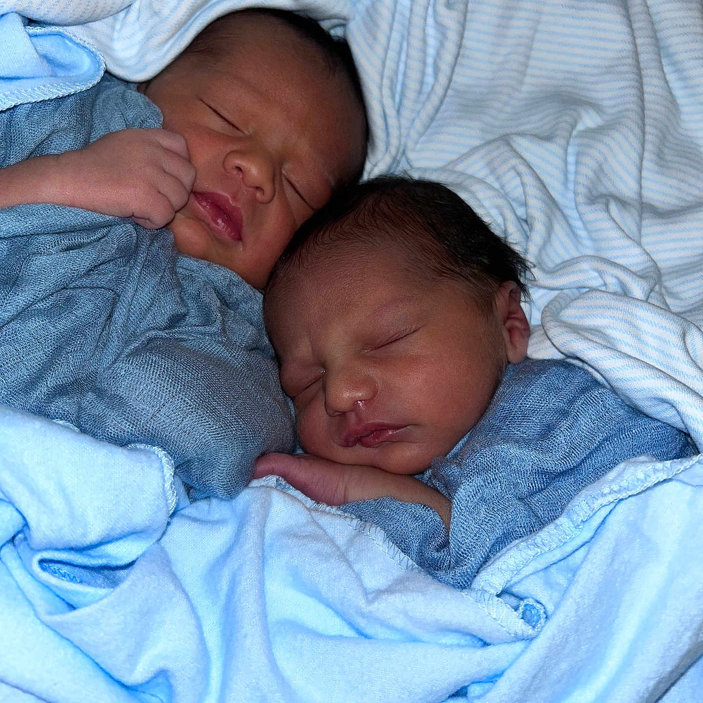 Masai Rhe Ra Iaomai joined the competition — help win amazing prizes! baby, bed, blanket, blue, bundle, child, cozy, cute, face, infant, newborn, peaceful, portrait, resting, sleeping, soft, swaddled, twin, two, warm