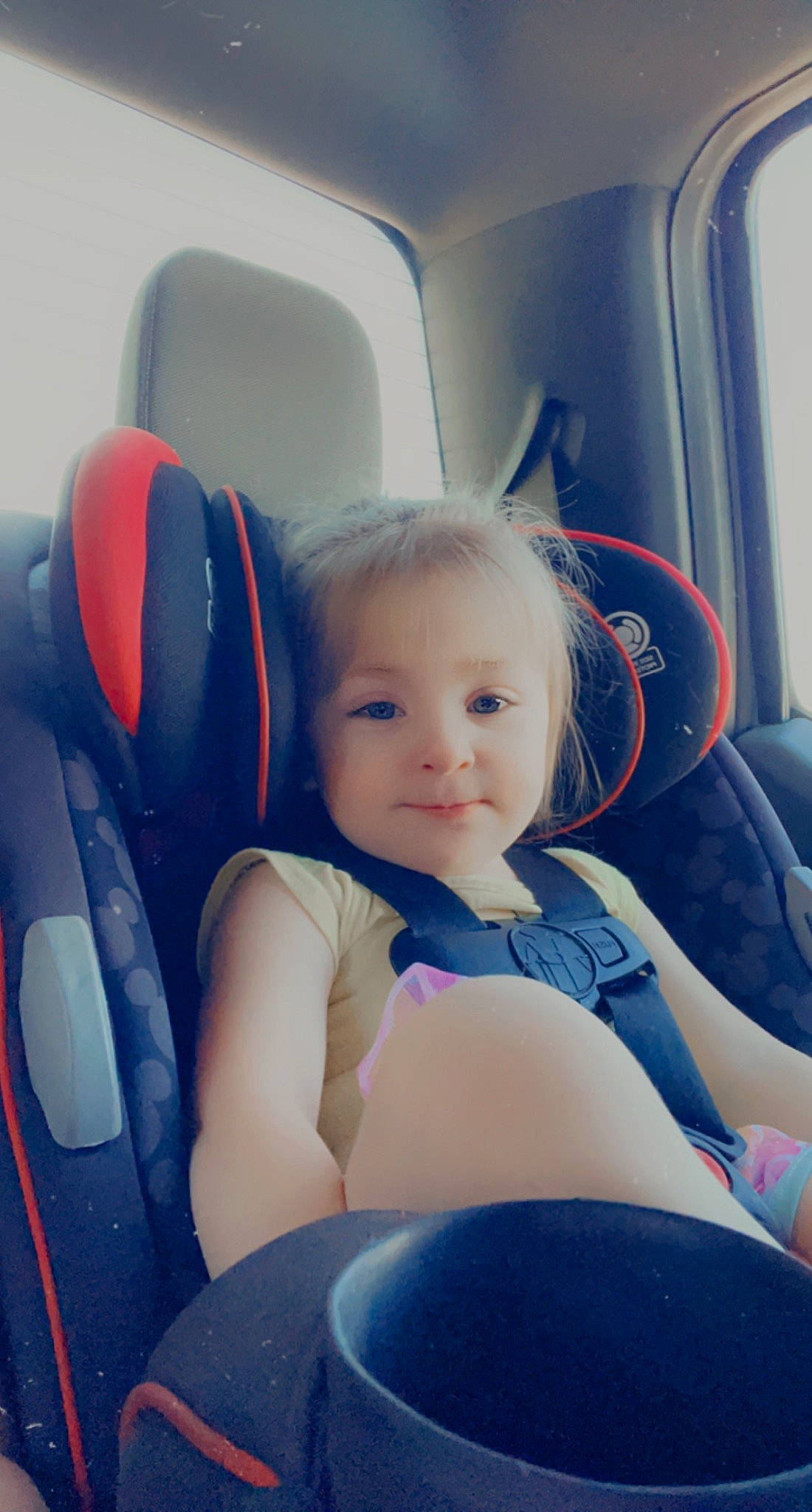 Jersey is registered to the contest to win money with this photo: auto_part, automotive_design, automotive_exterior, car, car_seat, car_seat_cover, comfort, electric_blue, fun, head_restraint, motor_vehicle, person, seat_belt, smile, steering_part, steering_wheel, toddler, vehicle, vehicle_door, white