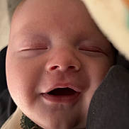 Tyson joined the competition — help win amazing prizes! baby, blanket, child, closed_eyes, closeup, clothing, comfort, cozy, cute, dinosaur_print, face, happy, infant, newborn, portrait, resting, sleeping, smile, soft, warm