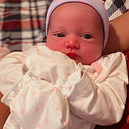 Serenah is registered to the contest to win money with this photo: newborn, baby, infant, beanie, clothing, white_outfit, pink_hearts, person, portrait, indoors, soft_lighting, closeup, cute, sleepwear, resting, human, headwear, face, baby_garment, warm