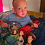 child, bed, blanket, toy_story, buzz_lightyear, jessie, woody, toy, chocolate, blue_shirt, indoor, red_curtain, bedroom, person, face, head, comfort, sleepwear, furniture, young_child