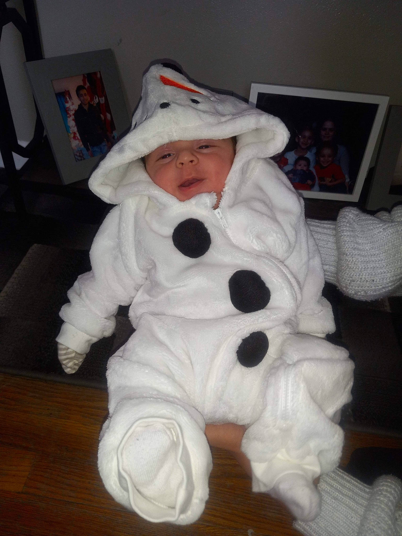 Krew is registered to the contest to win money with this photo: baby, baby_toddler_clothing, carmine, child, comfort, costume, eye, fun, fur, hat, head, headwear, joy, person, personal_protective_equipment, plush, room, sitting, stuffed_toy, toddler