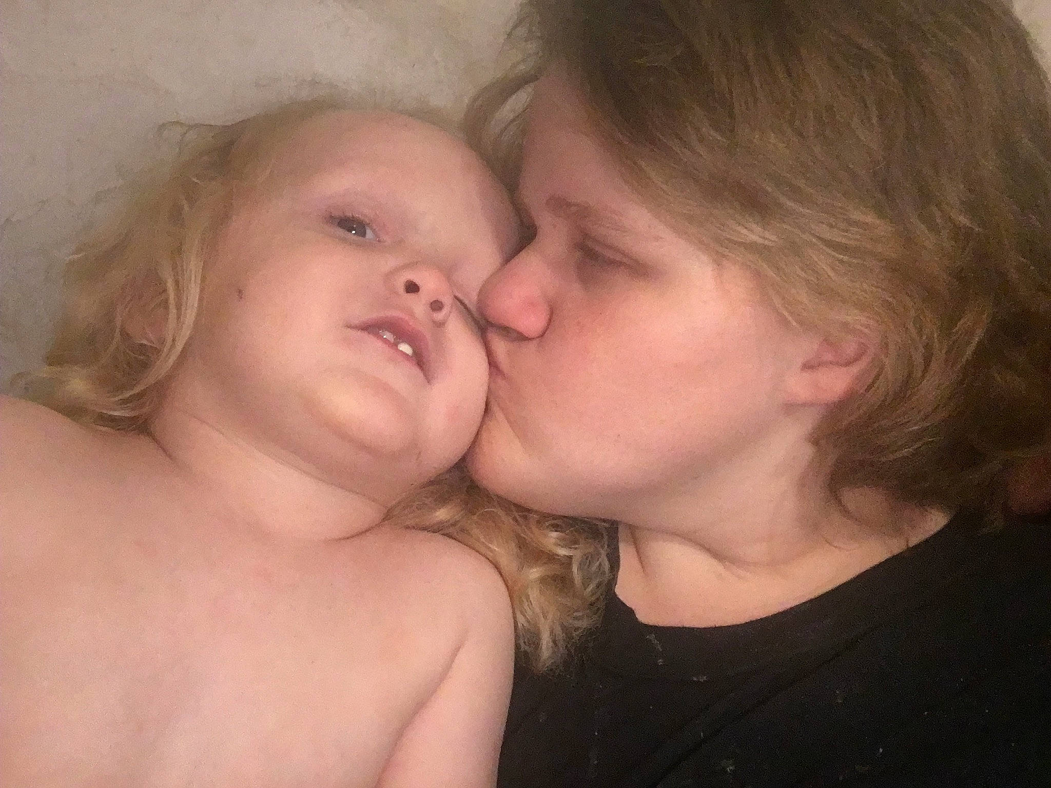 Gregory is registered to the contest to win money with this photo: blond, cheek, cheek_kissing, child, ear, face, gesture, interaction, kiss, lip, love, mouth, neck, nose, person, skin, smile, toddler