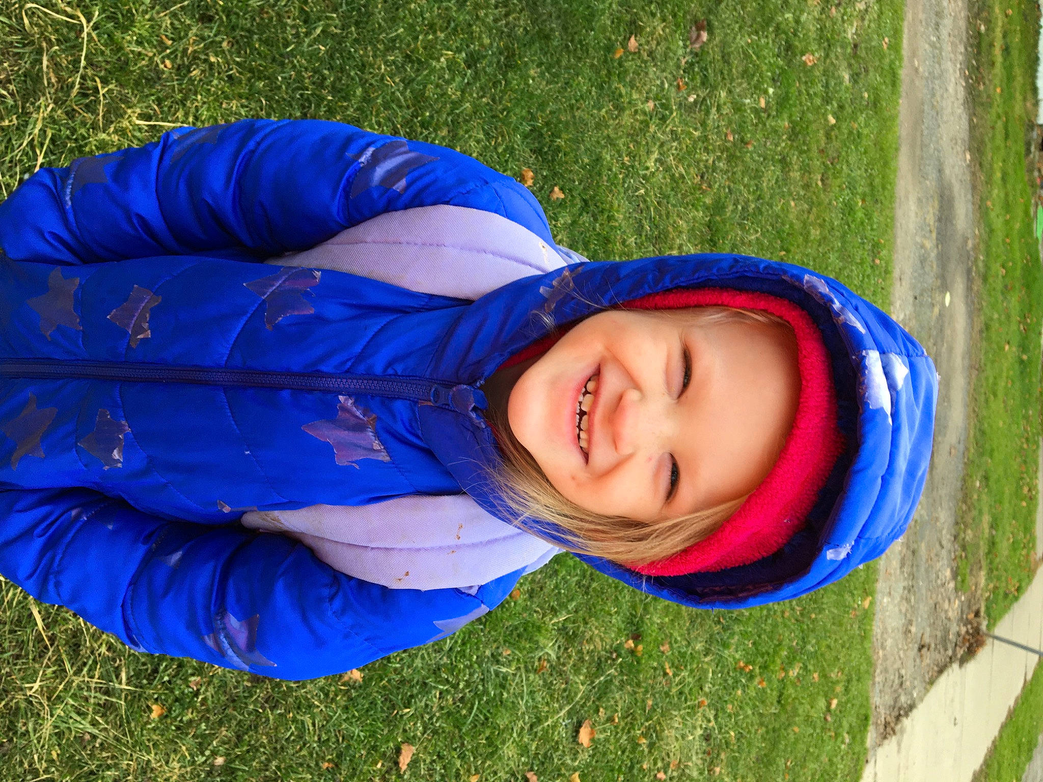 Emily is registered to the contest to win money with this photo: blue, cobalt_blue, electric_blue, happy, headwear, hood, jacket, joy, laugh, majorelle_blue, people_in_nature, person, purple, windbreaker