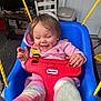 toddler, child, swing, blue_swing, pink_hoodie, striped_leggings, indoor, smiling, happy, face, messy_face, feet, toy, yellow_rope, door, chair, floor, wood, furniture, person