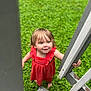 toddler, child, red_dress, outdoor, greenery, grass, wooden_stairs, railing, barefoot, happy, smiling, portrait, looking_up, curious, summer, nature, young_child, cute, daylight, playful