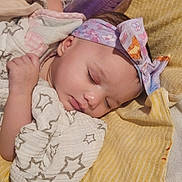 Avianna joined the competition — help win amazing prizes! baby, blanket, child, clothing, comfort, cozy, cute, headband, indoors, infant, peaceful, portrait, purple_bottle, relaxation, resting, sleeping, soft_texture, star_pattern, wrapped, yellow_towel