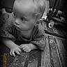 baby, child, face, curious, black_and_white, scratched_surface, wood, hands, gaze, portrait, floor, indoor, clothing, expression, young, infant, monochrome, timestamp, candid, person