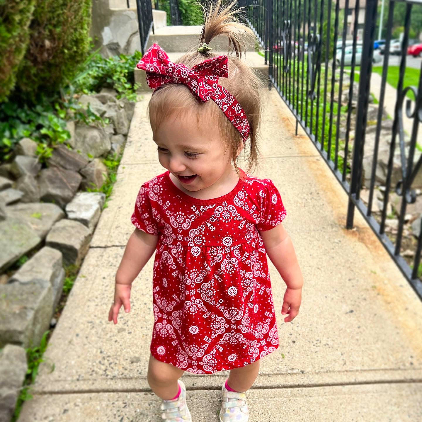 Maxine is registered to the contest to win money with this photo: baby, baby_toddler_clothing, beauty, child, day_dress, dress, fashion_accessory, fence, fun, grass, happy, headband, headgear, magenta, pattern, person, pink, plant, sleeve, smile