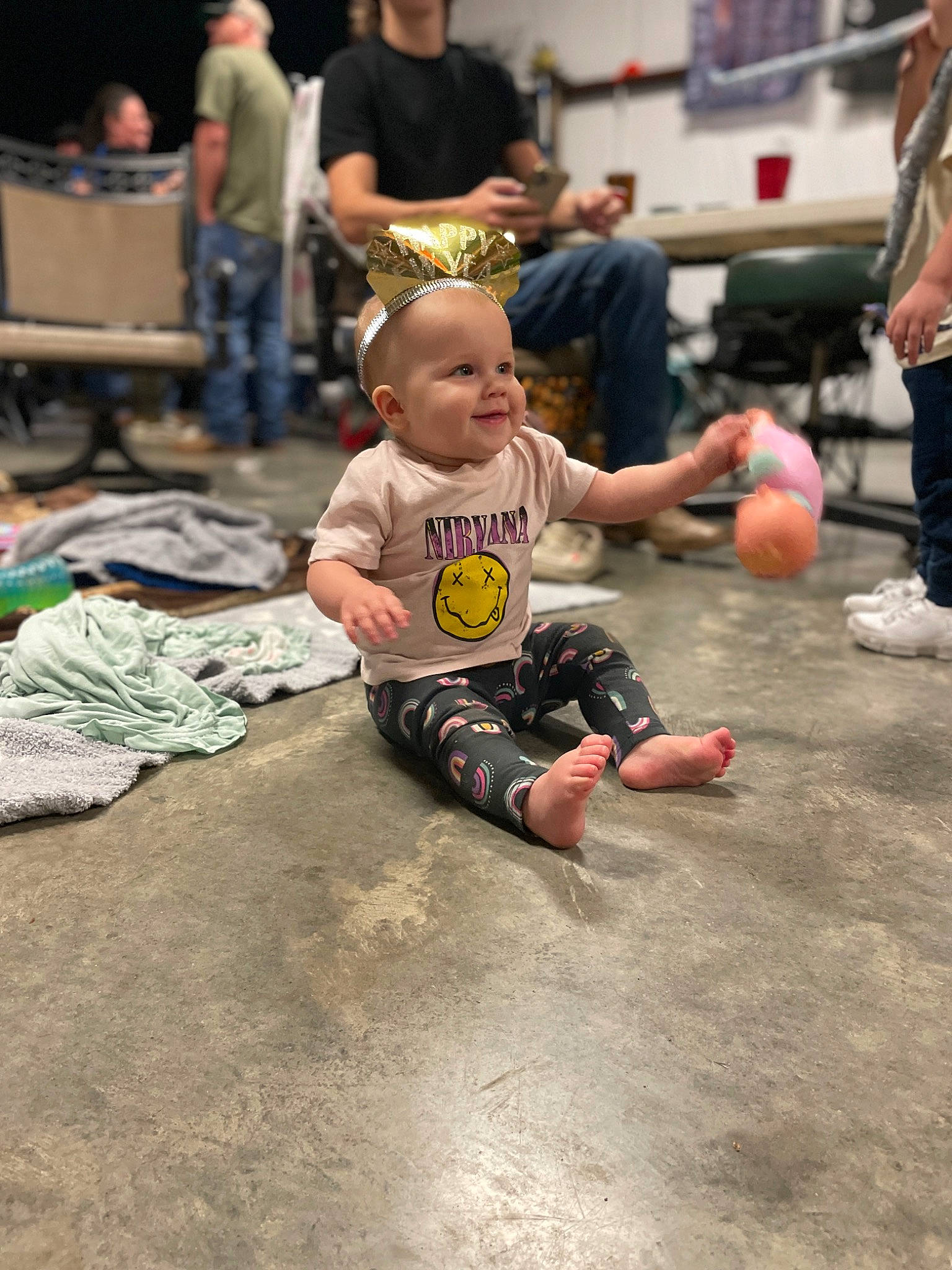 Breleigh is registered to the contest to win money with this photo: art, ball, child, competition_event, crowd, event, flooring, fun, games, joy, leisure, person, recreation, sand, shorts, sitting, sneakers, soil, sports, street