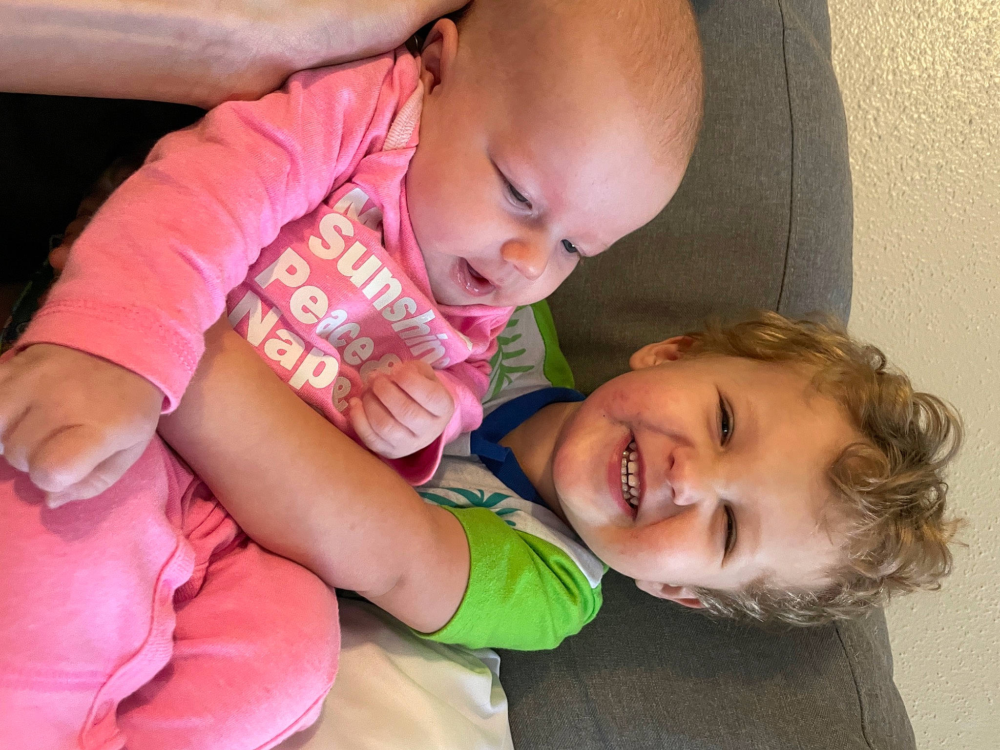 Brycen is registered to the contest to win money with this photo: arm, baby_toddler_clothing, cheek, comfort, eyebrow, face, finger, fun, gesture, hand, happy, iris, joy, lip, mouth, neck, nose, person, skin, smile