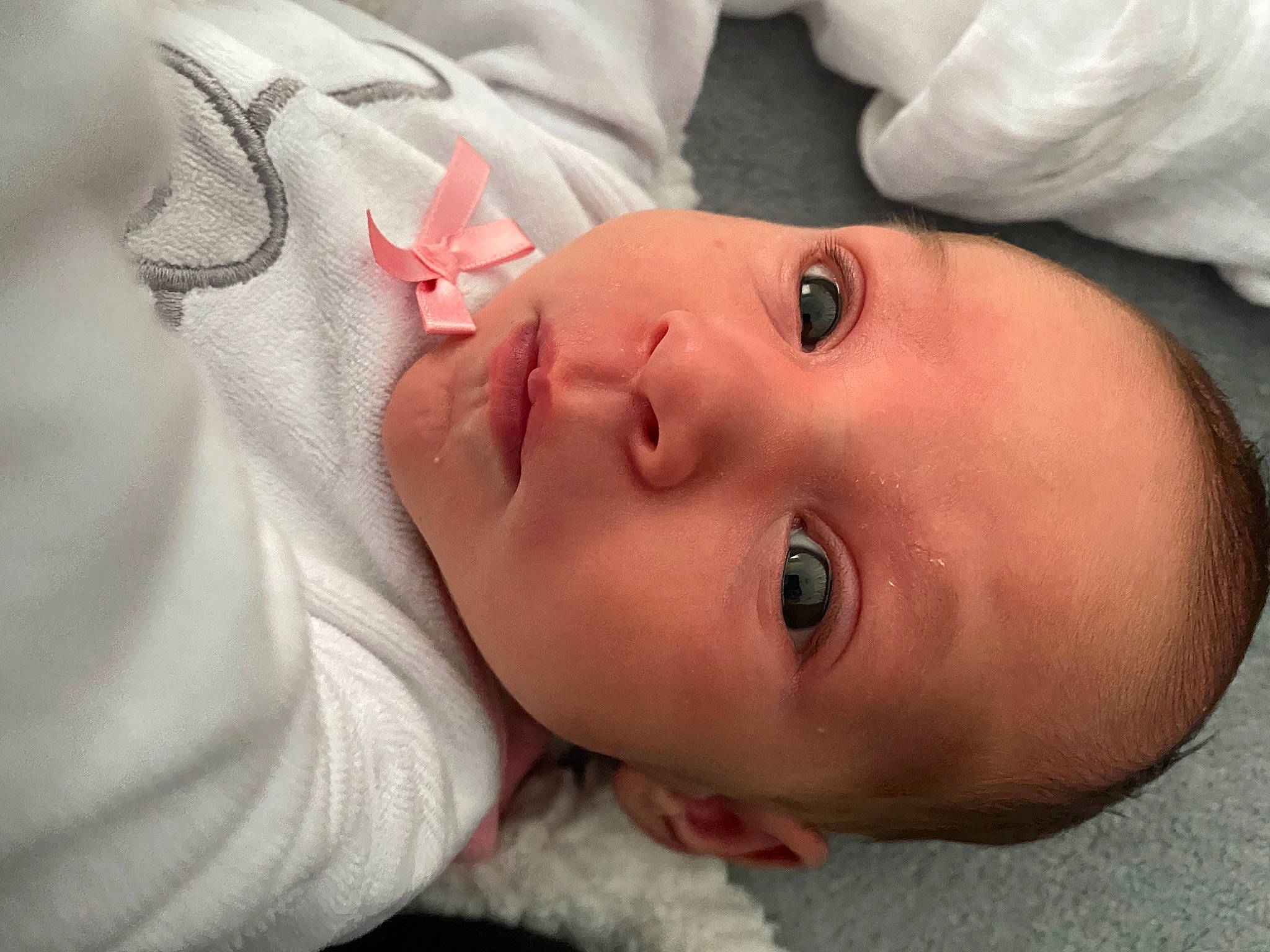 Rose participe au concours pour gagner de l'argent avec cette photo : arm, baby, baby_toddler_clothing, cheek, chin, ear, eyelash, face, hand, headgear, human_body, iris, lip, mouth, neck, nose, person, skin, sleeve, smile