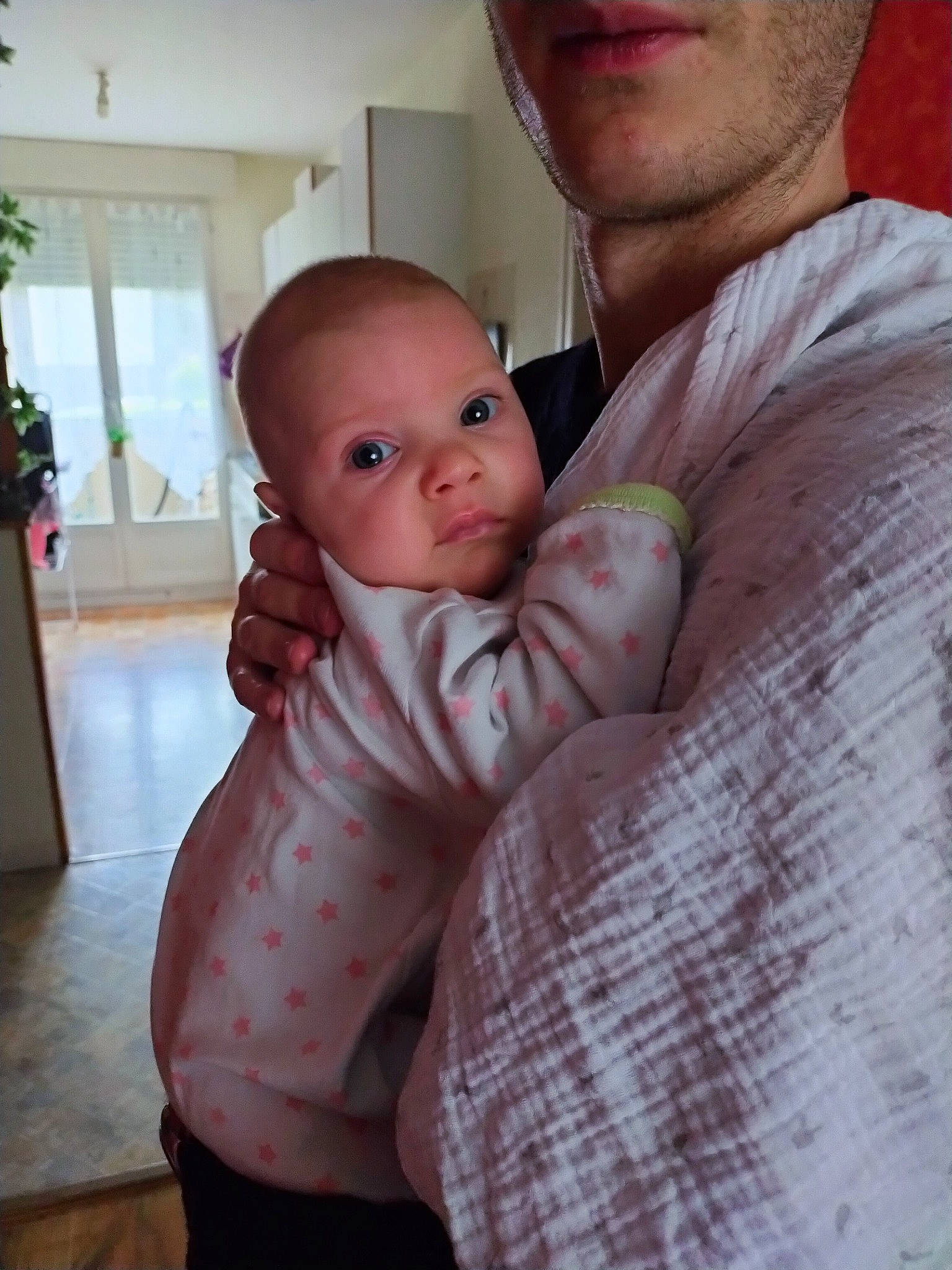 Emily participe au concours pour gagner de l'argent avec cette photo : abdomen, arm, baby, baby_toddler_clothing, cheek, chest, child, chin, comfort, happy, houseplant, lip, mouth, neck, nose, person, plant, skin, toddler, trunk