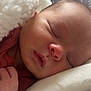 David is registered to the contest to win money with this photo: baby, sleeping, blanket, soft, cozy, infant, face, closed_eyes, newborn, pillow, texture, peaceful, rest, cute, child, warm, comfort, portrait, indoors, closeup