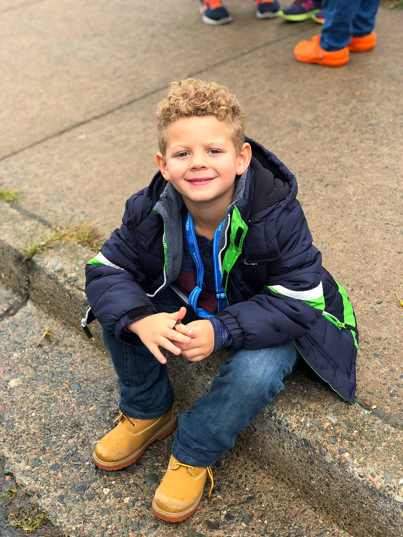 Sterling is registered to the contest to win money with this photo: child, community, fun, jacket, joy, male, outerwear, person, plant, play, sitting, smile, soil, toddler, tree, vacation