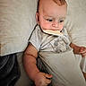 Jaeger joined the competition — help win amazing prizes! baby, child, infant, bed, blanket, pillow, onesie, bread, chewing, lying_down, cute, indoors, young_child, face, head, arm, hand, fabric, sleepwear, resting