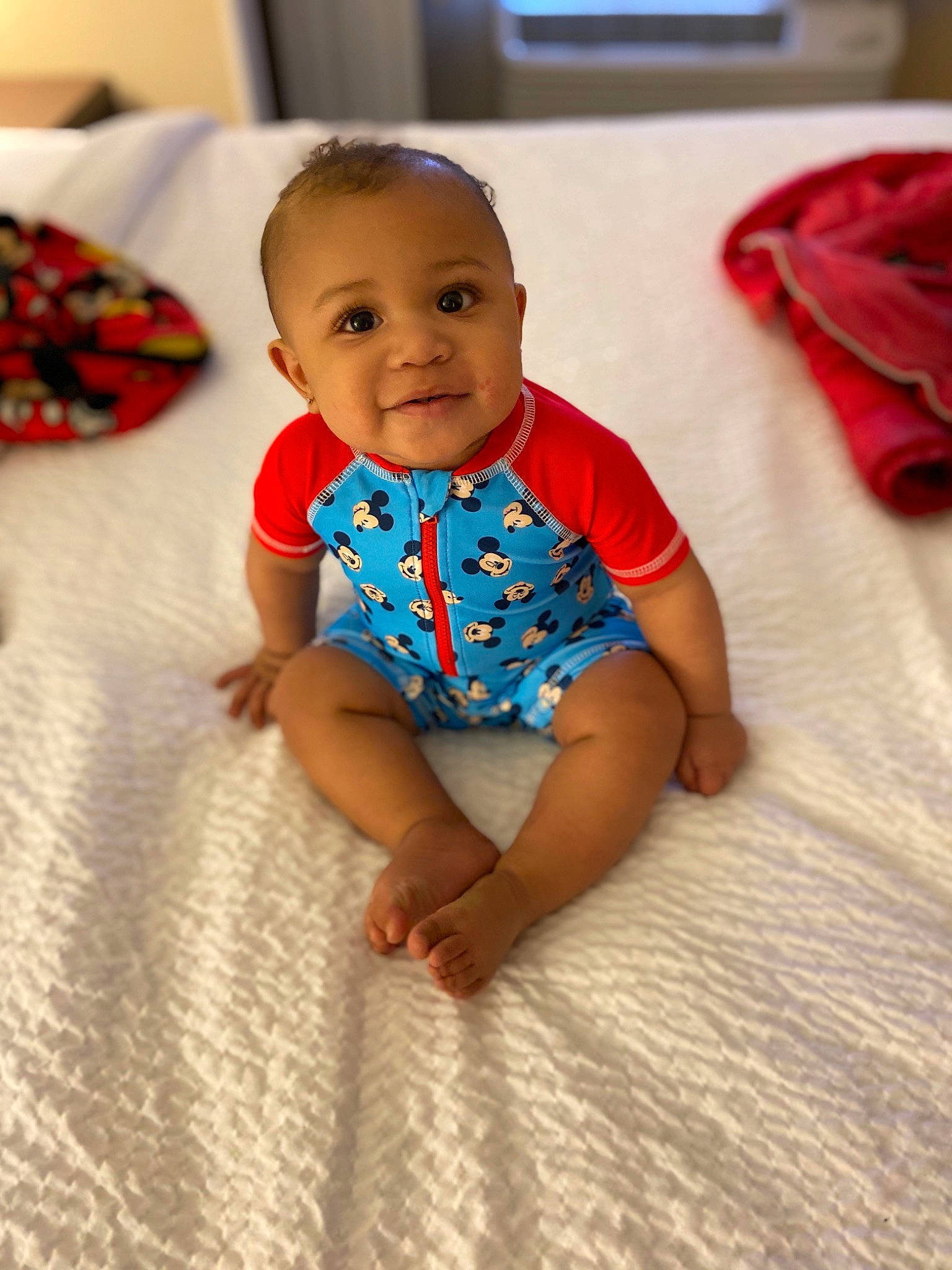 Damarion is registered to the contest to win money with this photo: arm, baby, baby_toddler_clothing, cheek, chin, comfort, face, facial_expression, finger, floor, flooring, hand, head, iris, joint, joy, person, product, skin, sleeve