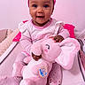 Manolie participe au concours pour gagner de l'argent avec cette photo : baby, child, pink, plush_toy, elephant, smiling, cute, infant, sitting, toy, soft_toy, indoors, happy, clothing, headwear, sock, childrens_room, cushion, person, portrait