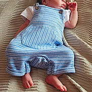 Zayne is registered to the contest to win money with this photo: newborn, baby, sleeping, blue_overalls, blanket, infant, cute, peaceful, resting, soft_texture, clothing, foot, hand, portrait, indoors, child, young, small, cozy, sleep
