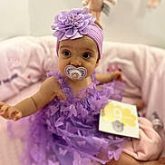Lyliana participe au concours pour gagner de l'argent avec cette photo : baby, purple_dress, headband, flower, pacifier, butterfly, sitting, pink_blanket, soft_toy, milestone_card, indoors, child, cute, smiling_eyes, infant, decor, toy, portrait, cozy, happy