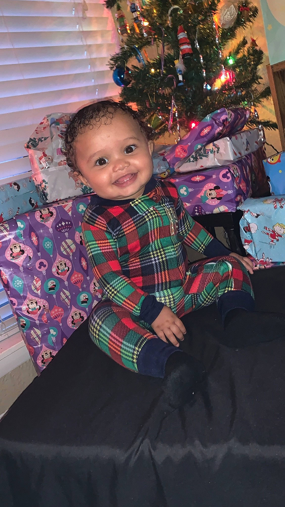 Brooklyn joined the competition — help win amazing prizes! christmas, christmas_decoration, christmas_ornament, christmas_tree, event, fun, happy, holiday, holiday_ornament, joy, ornament, pattern, person, plaid, plant, sitting, sleeve, smile, standing, tartan