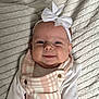 Lottie joined the competition — help win amazing prizes! baby, smiling, headband, bow, infant, clothing, pink, white, blanket, texture, cute, portrait, face, child, happy, soft, lying_down, button, closeup, indoors