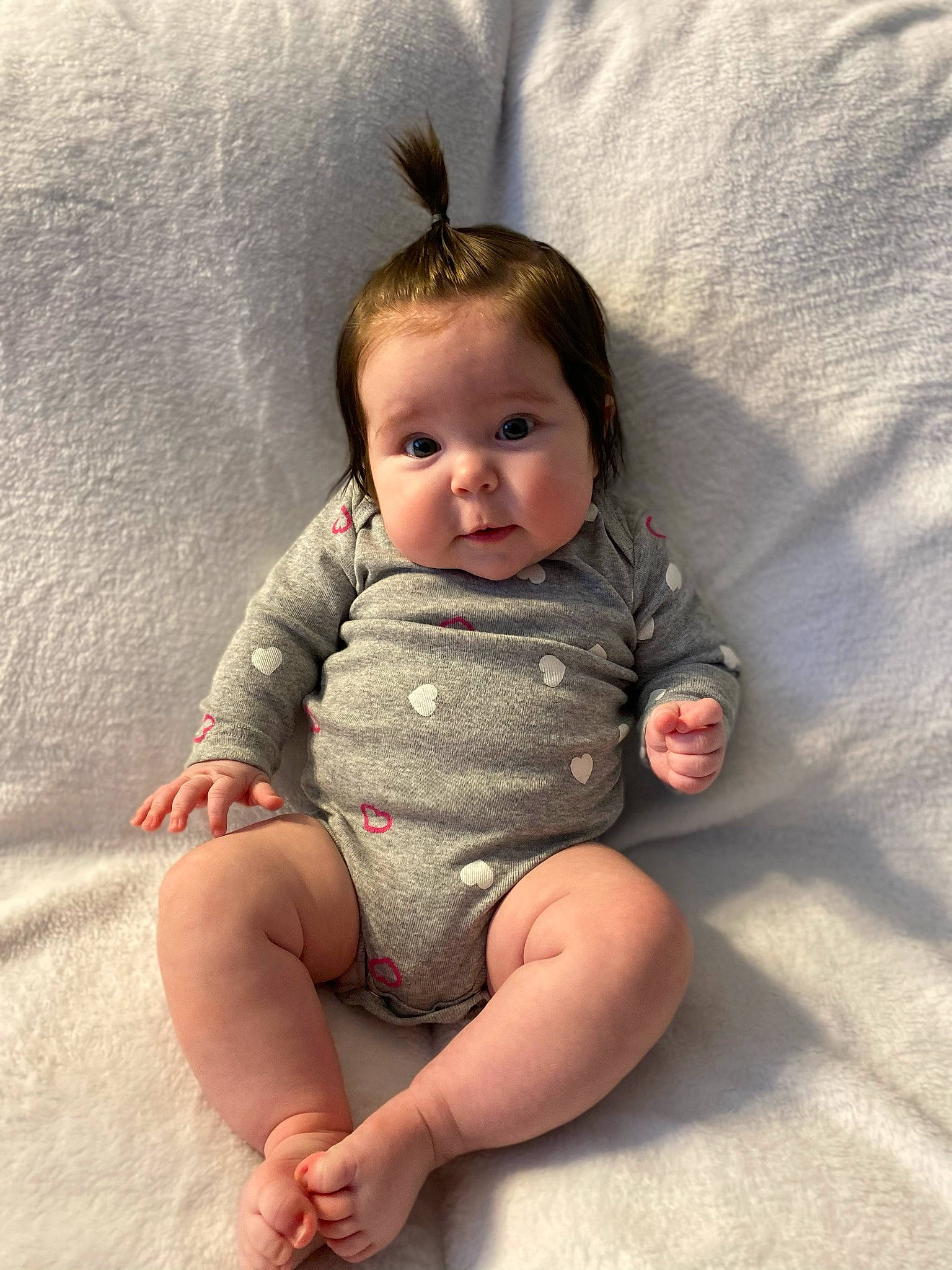 Hadlie is registered to the contest to win money with this photo: arm, baby, baby_toddler_clothing, cheek, chin, comfort, eye, face, finger, hair, happy, head, human_body, iris, leg, lip, neck, nose, person, skin