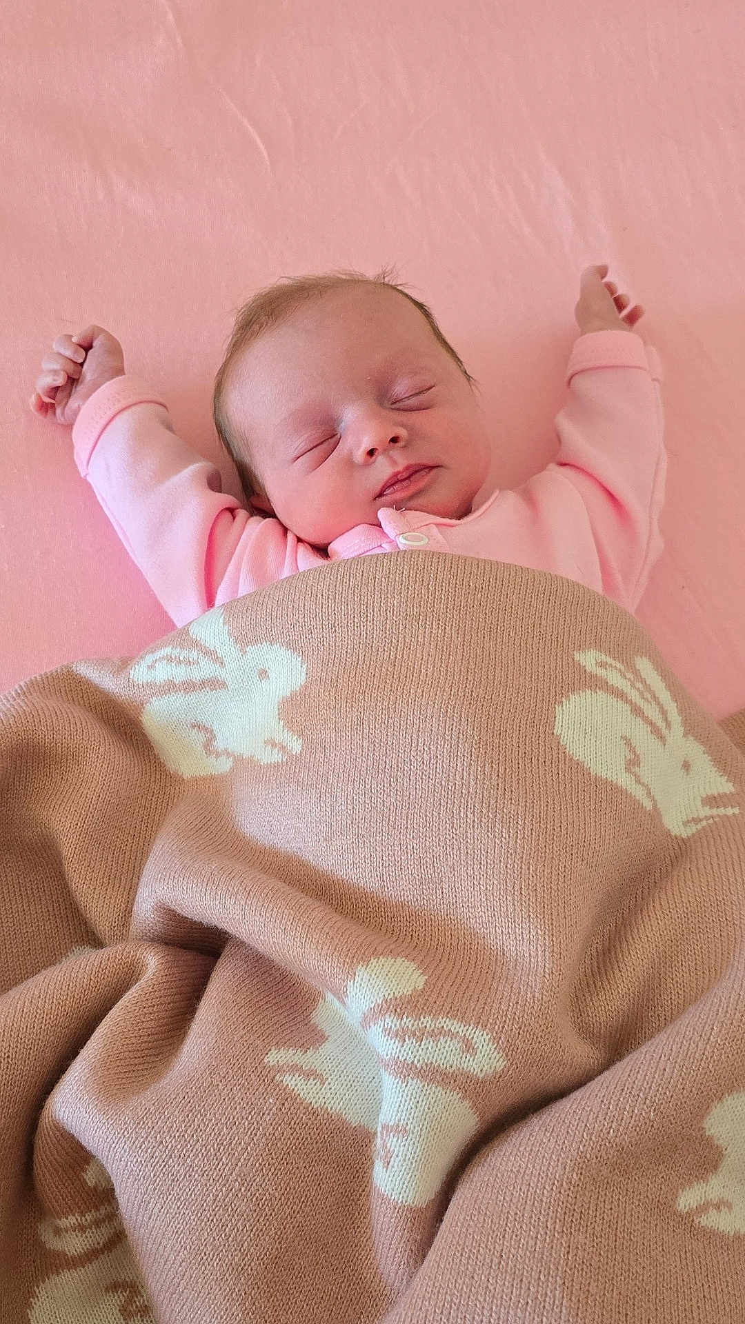Ruairi-Rae joined the competition — help win amazing prizes! newborn, baby, sleeping, pink, blanket, knitted_blanket, bunny_pattern, arms_stretched, cozy, soft, infant, cute, peaceful, lying_down, indoor, child, portrait, sleepwear, resting, toddler