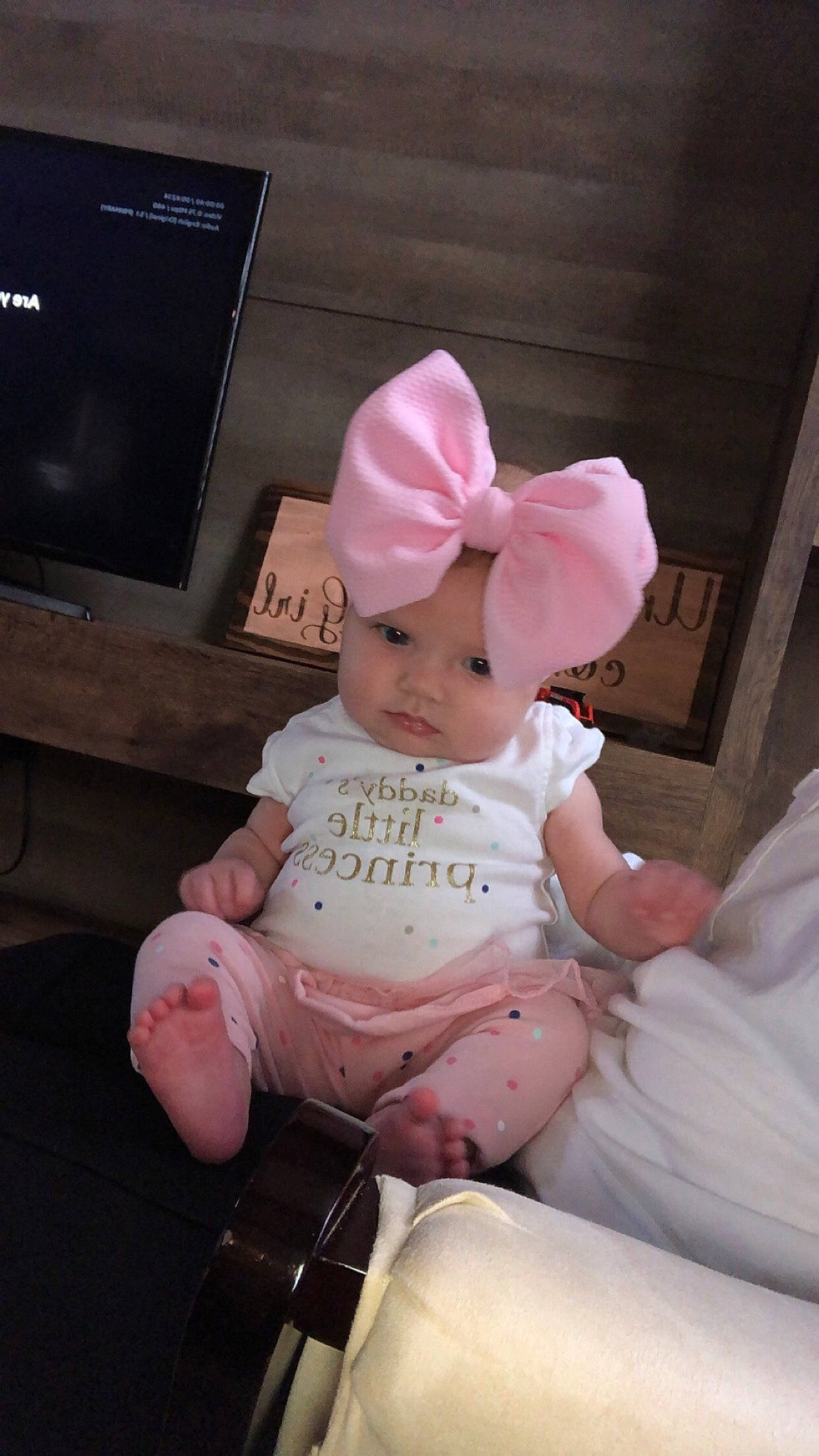 Kayzlee is registered to the contest to win money with this photo: baby, cap, child, furniture, headgear, person, pink, sitting, skin, toddler