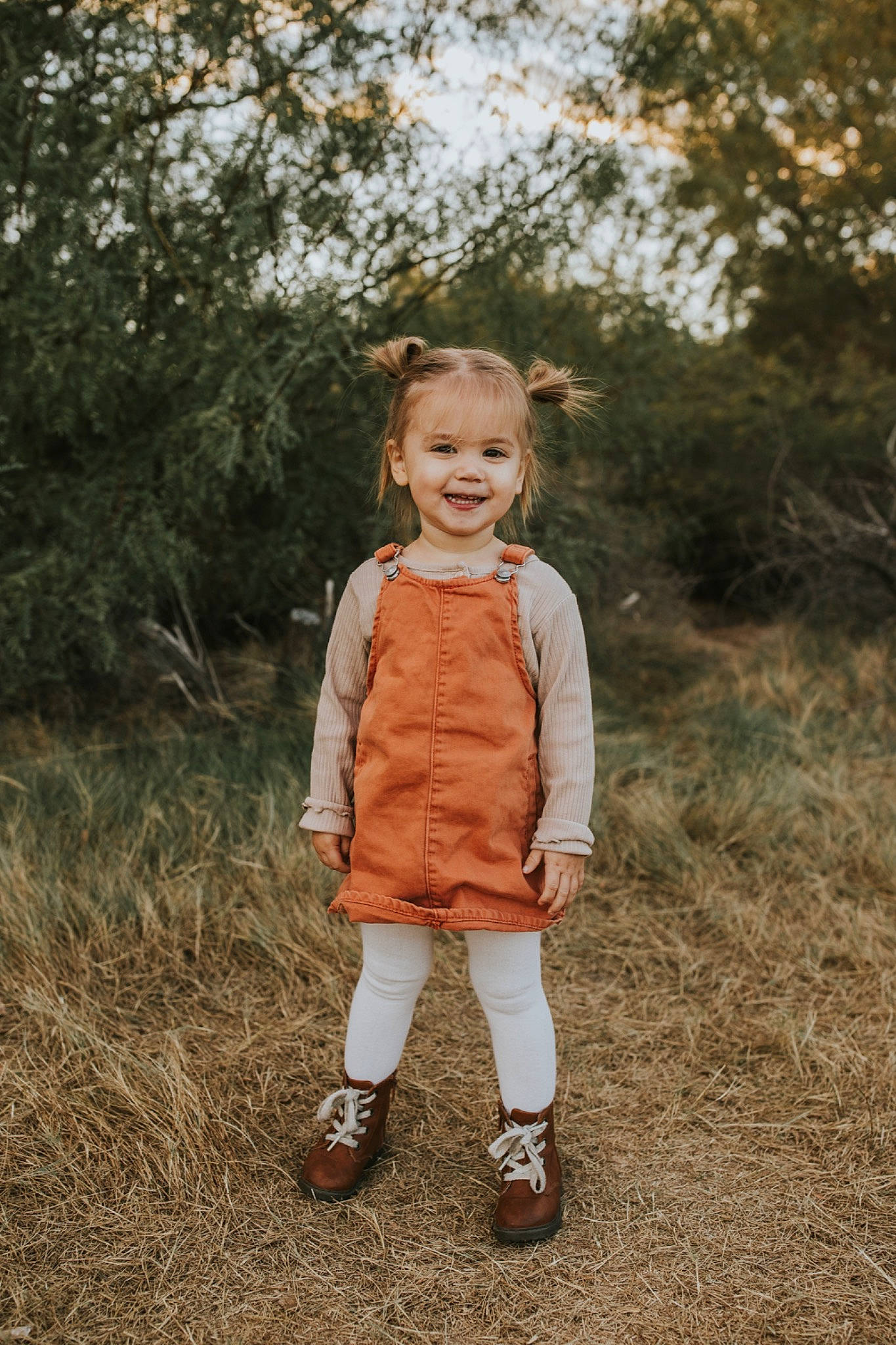 Emory joined the competition — help win amazing prizes! boot, child, face, flash_photography, fur, gesture, grass, grassland, happy, joy, landscape, natural_landscape, people_in_nature, person, plant, prairie, smile, soil, toddler, tree