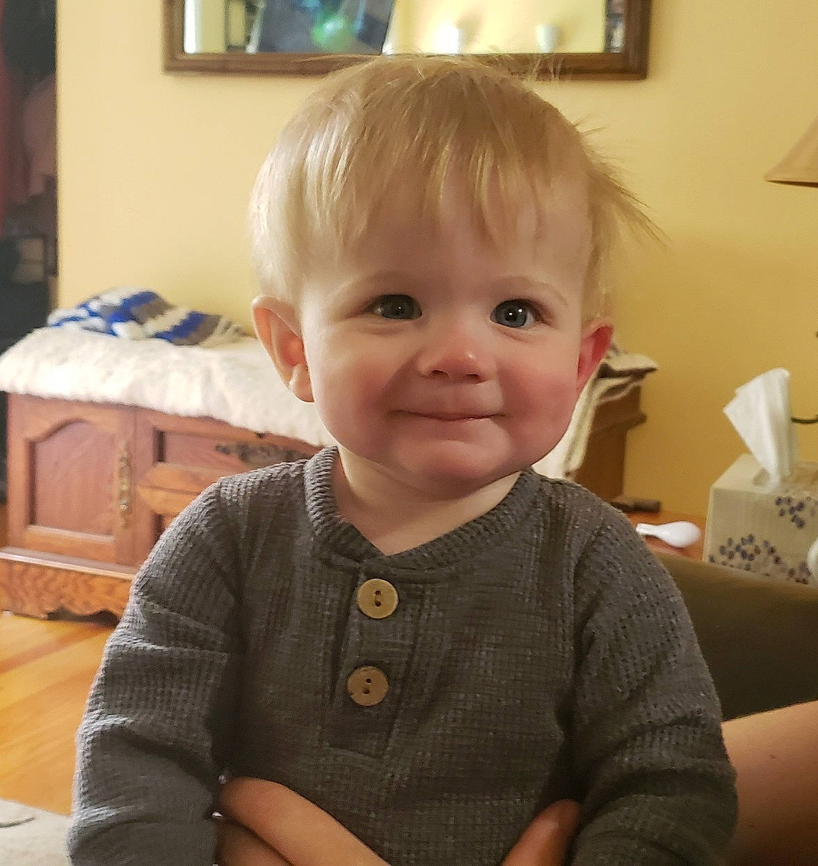 Henry is registered to the contest to win money with this photo: baby, baby_toddler_clothing, cheek, child, finger, fun, hairstyle, happy, head, joy, nose, person, picture_frame, room, sitting, skin, sleeve, smile, standing, t_shirt