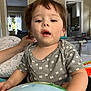 Matthew Gael is registered to the contest to win money with this photo: casual, child, clothing, curious, curtain, expression, face, furniture, hair, hand, home, indoor, living_room, person, pillow, playpen, skin, toddler, toy, window