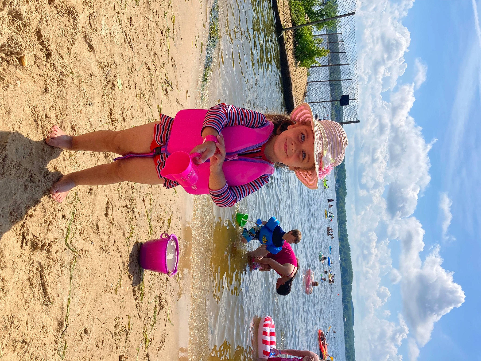 Rebeca is registered to the contest to win money with this photo: adventure, azure, beach, electric_blue, fun, green, happy, headwear, joy, leisure, magenta, people_in_nature, person, pink, plant, recreation, sky, thigh, travel, wall