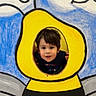 Romeo is registered to the contest to win money with this photo: child, face, portrait, yellow, bee, cutout, painting, wood, blue, gray, playful, curious, young, boy, outdoor, colorful, art, smiling, hands, hair