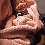 baby, blanket, smile, infant, cozy, pink, soft, wrapped, sleepy, cute, child, face, happy, indoor, portrait, newborn, resting, comfort, warmth, toddler