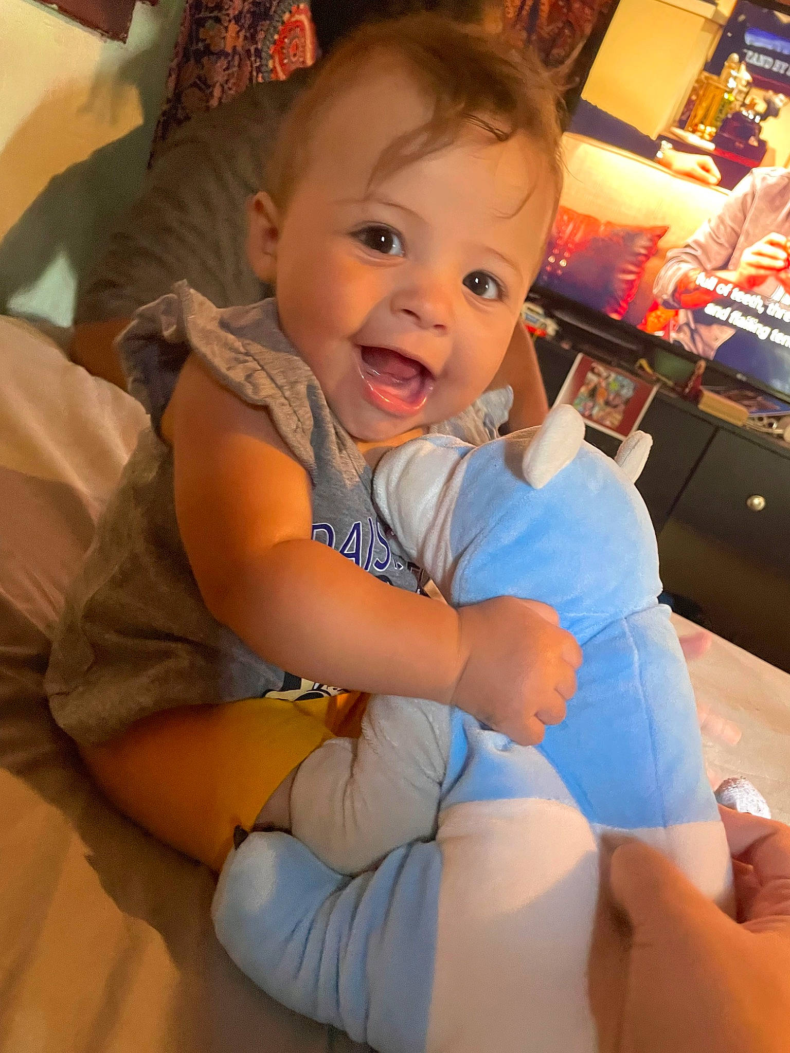 Braelyn is registered to the contest to win money with this photo: baby, baby_toddler_clothing, cheek, comfort, eye, finger, happy, head, human_body, iris, joint, lap, leg, mouth, person, skin, smile, thigh, thumb, toddler