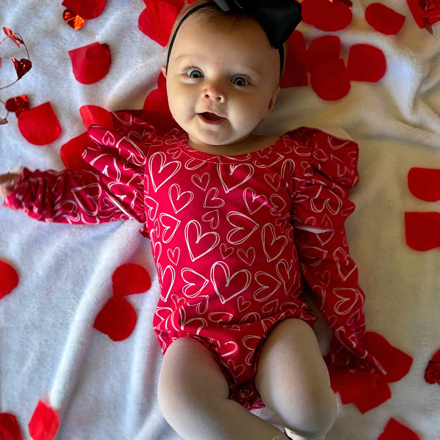 Delilah joined the competition — help win amazing prizes! applique, baby, bodypart, clothing, cushion, dress, face, finger, flower, formalwear, glove, hand, head, homedecor, pattern, person, petal, photography, plant, portrait