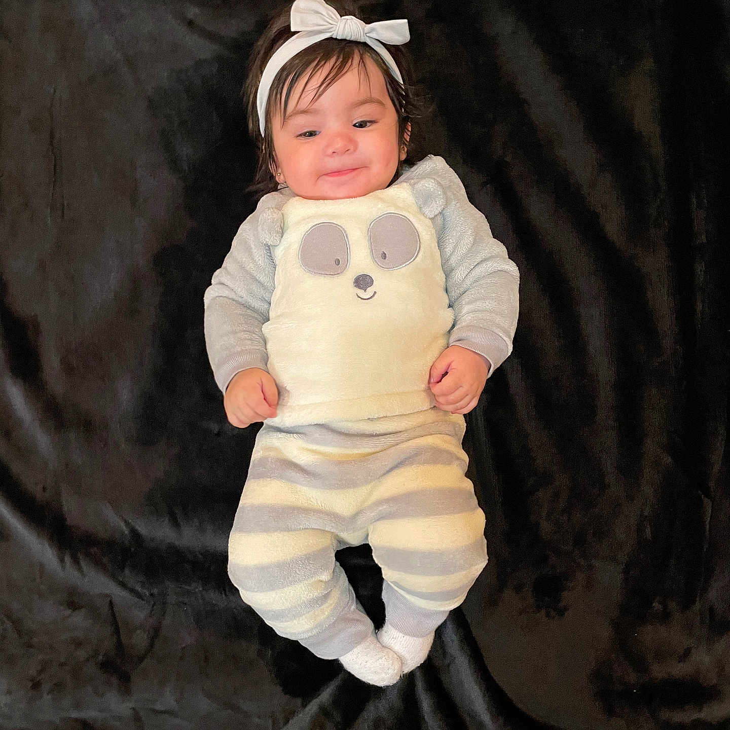 Neylani is registered to the contest to win money with this photo: accessories, baby, bodypart, clothing, costume, dress, face, finger, hand, happy, hat, head, longsleeve, newborn, pants, person, photography, portrait, sleeve, smile
