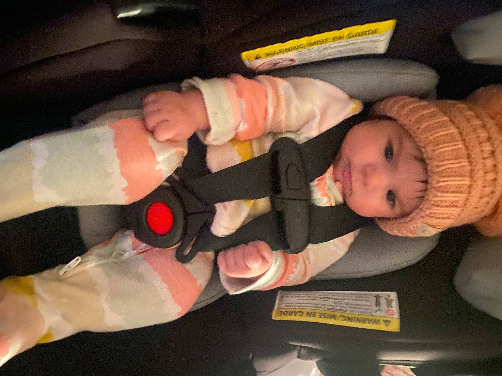 Neylani is registered to the contest to win money with this photo: arm, auto_part, baby, baby_carriage, baby_products, baby_toddler_clothing, car_seat, child, comfort, finger, gesture, hand, headwear, human_body, lap, mouth, nail, person, skin, thumb