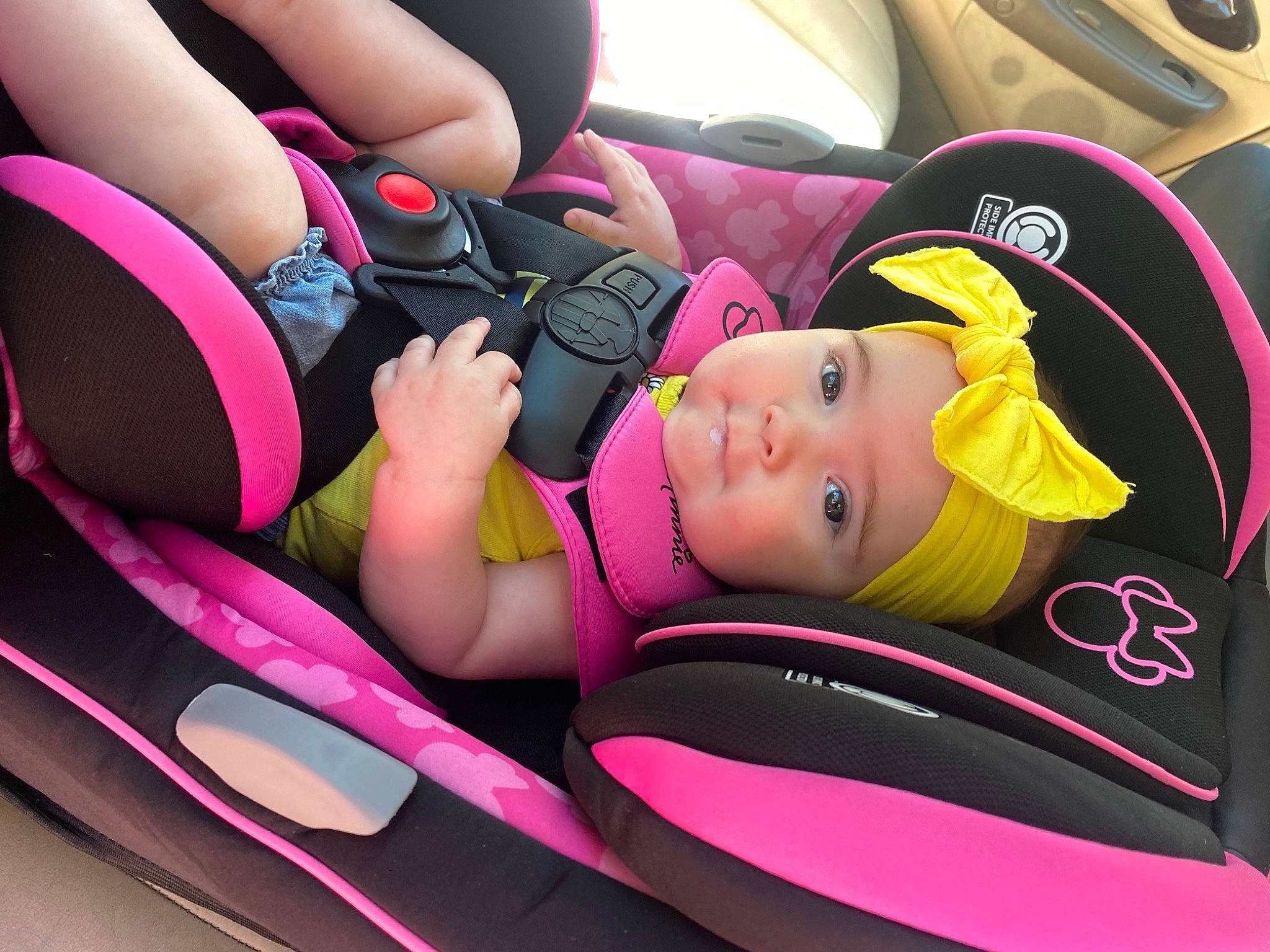 Aiyana joined the competition — help win amazing prizes! auto_part, automotive_design, automotive_exterior, car, car_seat, car_seat_cover, comfort, head_restraint, headwear, land_vehicle, light, mode_of_transport, motor_vehicle, person, pink, seat_belt, smile, steering_part, steering_wheel, toddler