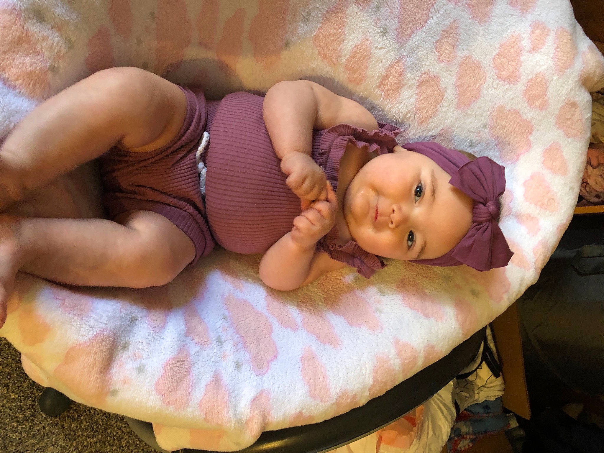 Aiyana joined the competition — help win amazing prizes! abdomen, baby, bed, chest, child, comfort, doll, eye, finger, glasses, headwear, human_body, linens, person, pink, skin, textile, thigh, toddler, toy