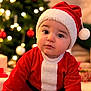 baby, child, christmas, cozy, cute, decorations, feet, festive, happy, hat, holiday, indoors, lights, ornaments, portrait, red_clothing, santa_claus, seasonal, smiling, tree
