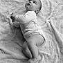 Solann a rejoint le concours — aidez-le/la à gagner de superbes lots ! baby, infant, child, black_and_white, blanket, texture, laying_down, clothing, onesie, barefoot, cute, portrait, soft_light, expression, hands, feet, face, skin, young, indoors