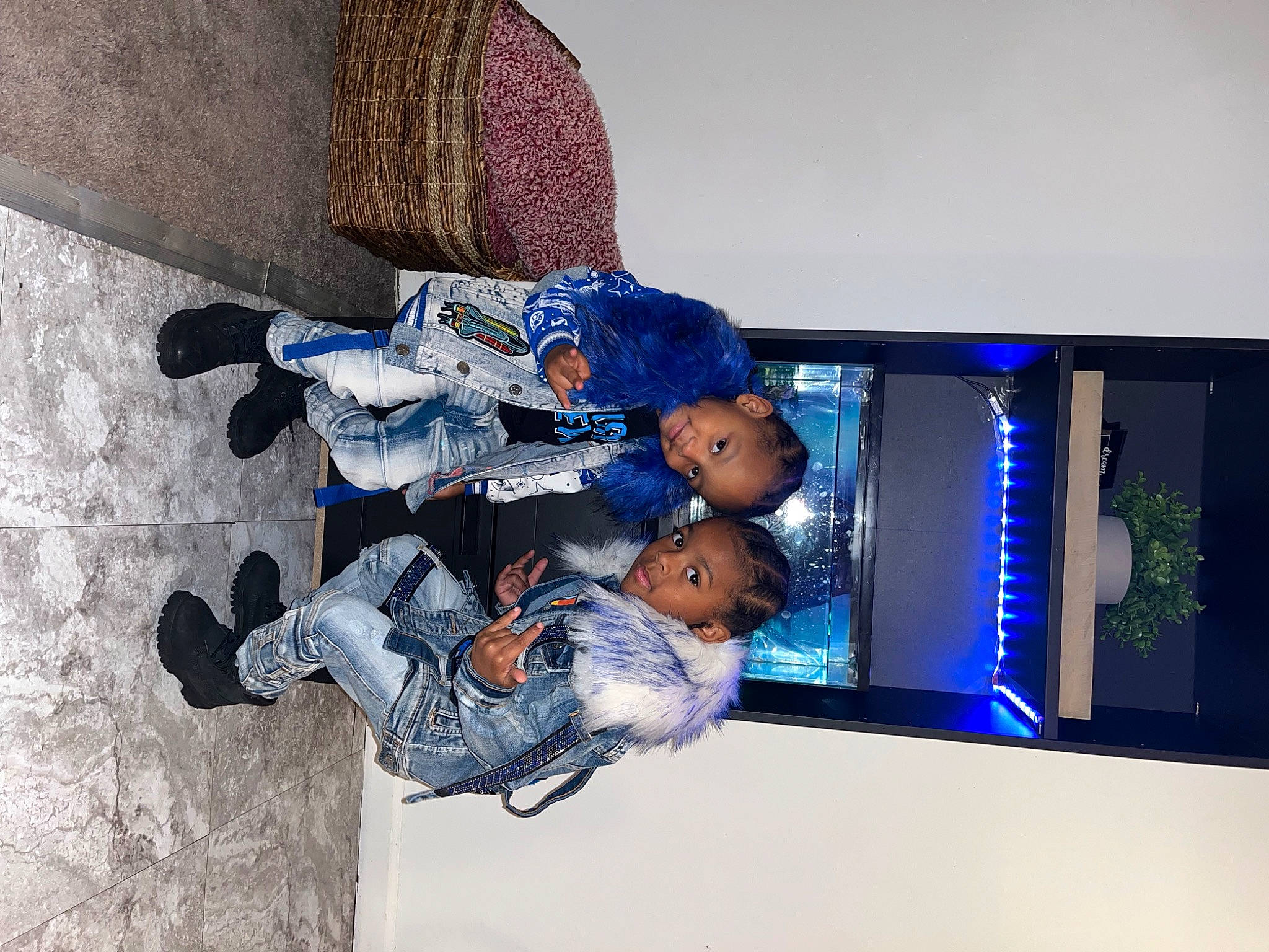 Darrin is registered to the contest to win money with this photo: child, denim, display_device, electric_blue, flooring, fun, joy, leisure, person, plant, recreation, room, toddler, tree, walking_shoe, world