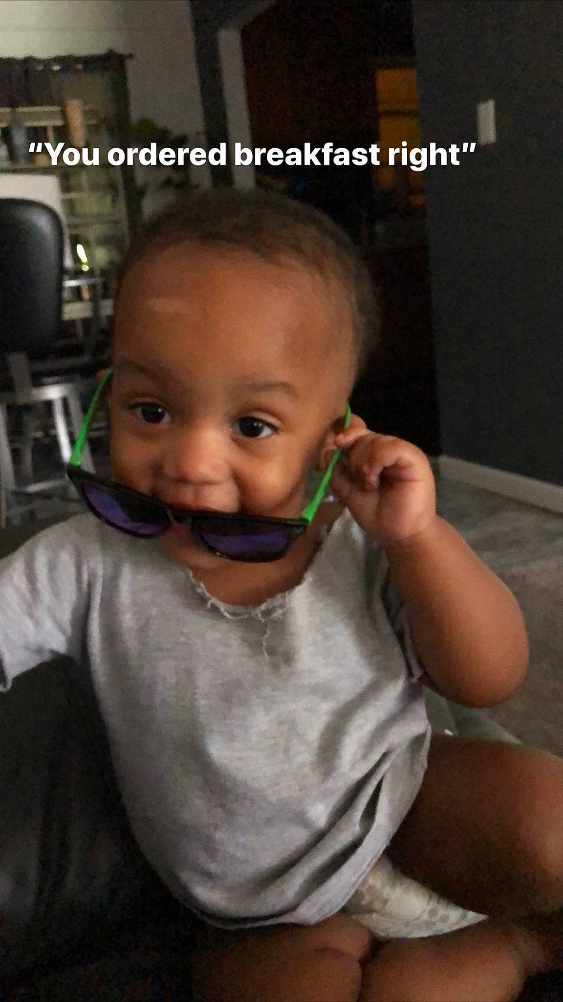 Dakari is registered to the contest to win money with this photo: baby, cheek, chin, cool, ear, eye, eyebrow, eyelash, finger, forehead, gesture, hair, happy, iris, jaw, mouth, nose, person, skin, tableware