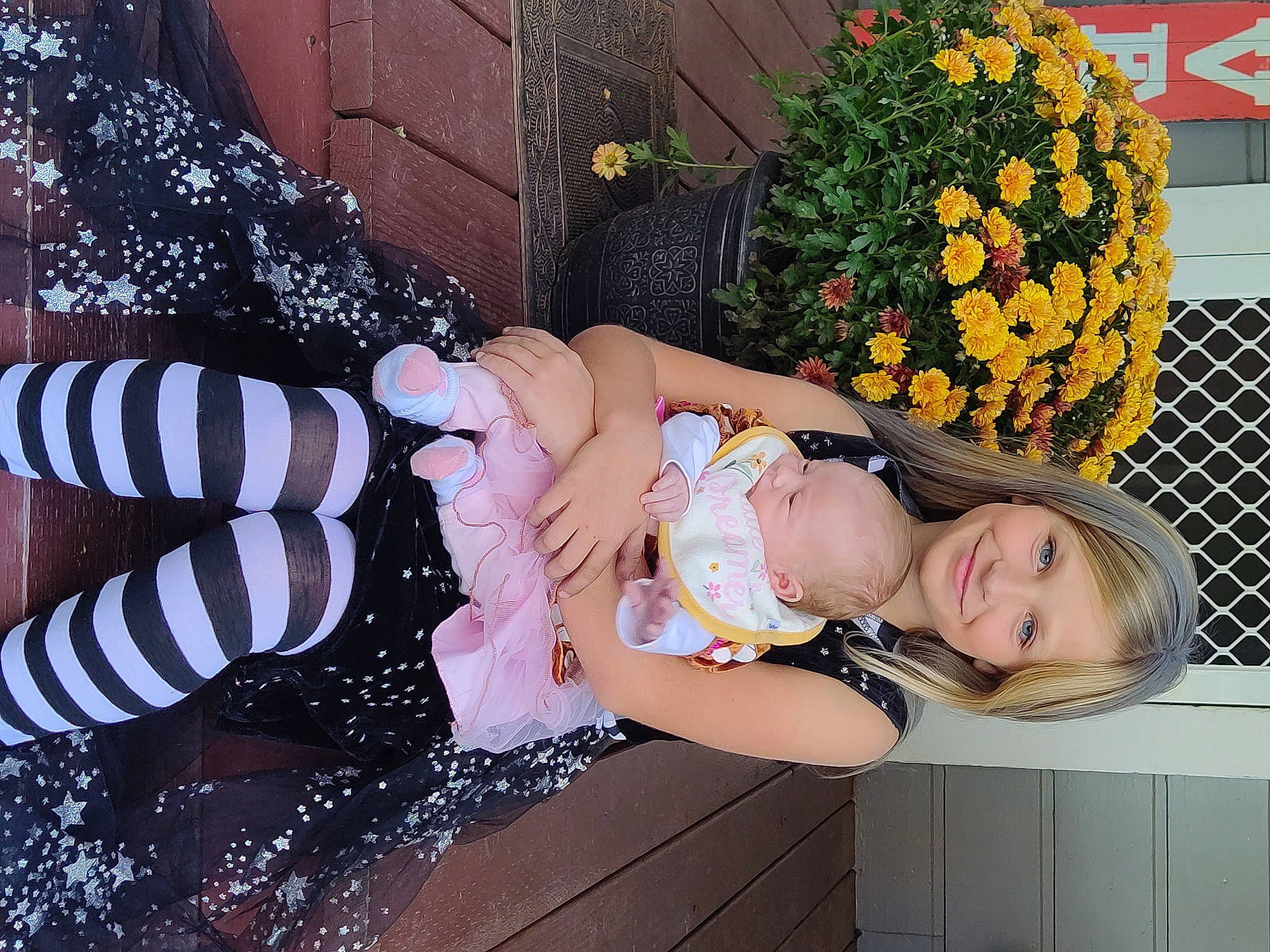 Isabella joined the competition — help win amazing prizes! event, eyewear, fashion_accessory, fence, floral_design, flower, flower_arranging, fun, grass, happy, human_leg, joy, leisure, pattern, person, petal, pink, plant, sandal, sitting