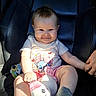 Nevaeh is registered to the contest to win money with this photo: baby, child, smiling, plush_toy, unicorn, shirt, cartoon_character, shorts, socks, leather_chair, hand_holding, sunlight, indoor, cute, happy, portrait, person, infant, seat, cozy