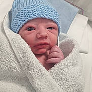 Lorenzo joined the competition — help win amazing prizes! newborn, baby, infant, wrapped, towel, blue_hat, hand, face, hospital, bed, blanket, skin, person, cute, sleepwear, portrait, closeup, cozy, soft, newborn_baby