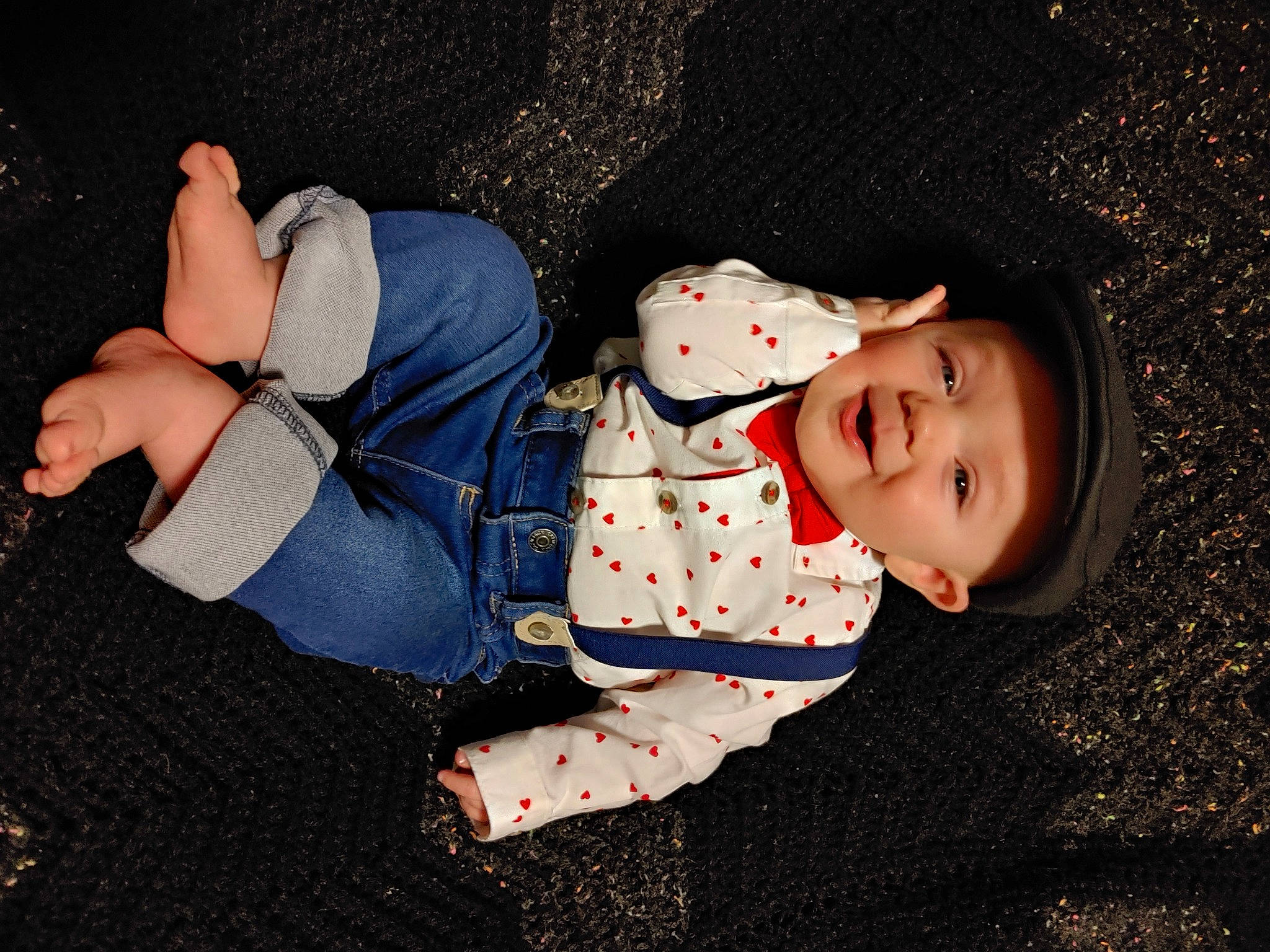 Gavyn is registered to the contest to win money with this photo: baby, baby_toddler_clothing, carmine, child, cool, elbow, flash_photography, fun, happy, headwear, human_leg, knee, leg, pattern, person, sitting, smile, sock, space, thigh